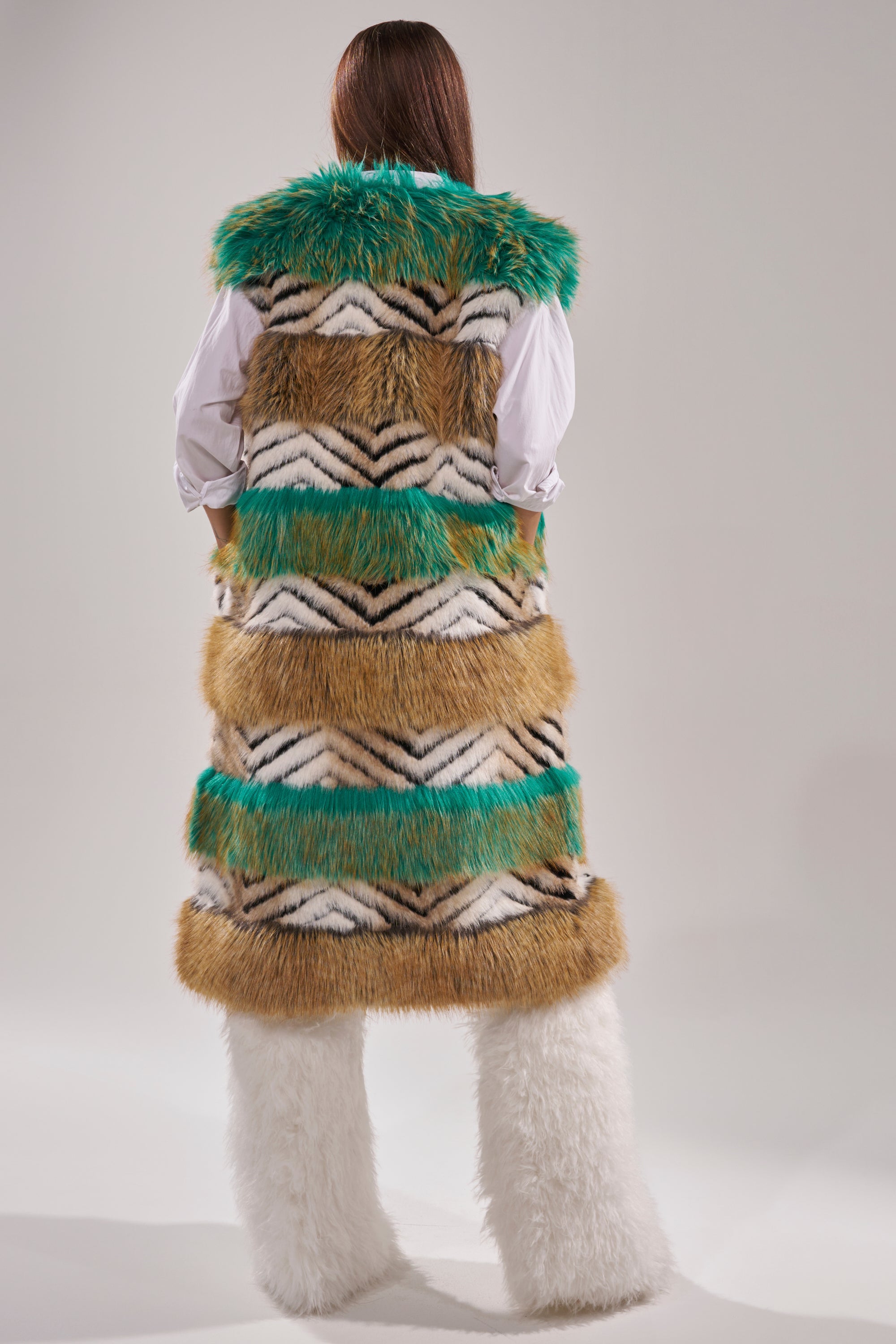 A person wearing the HYDE PARK FAUX FUR VEST, highlighting winter luxury. 8