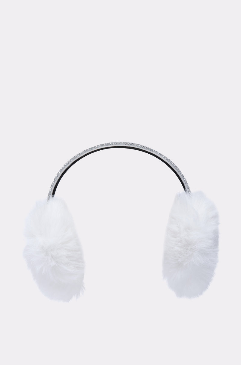 The EXTRA RHINESTONE EAR MUFFS IN WHITE feature fluffy white faux fur and a black and silver headband, shown against a plain light gray background—an elegant winter accessory.