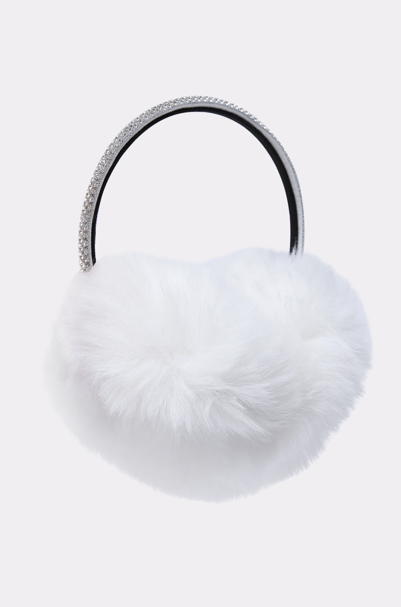 The EXTRA RHINESTONE EAR MUFFS IN WHITE feature plush white faux fur and a jeweled headband, making them the perfect winter accessory against a plain light background. 5
