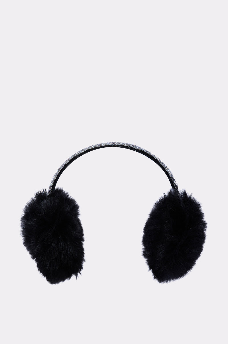 The EXTRA RHINESTONE EAR MUFFS IN BLACK feature fluffy black faux fur with a sparkly rhinestone headband, shown on a plain light background—a chic and cozy winter accessory.