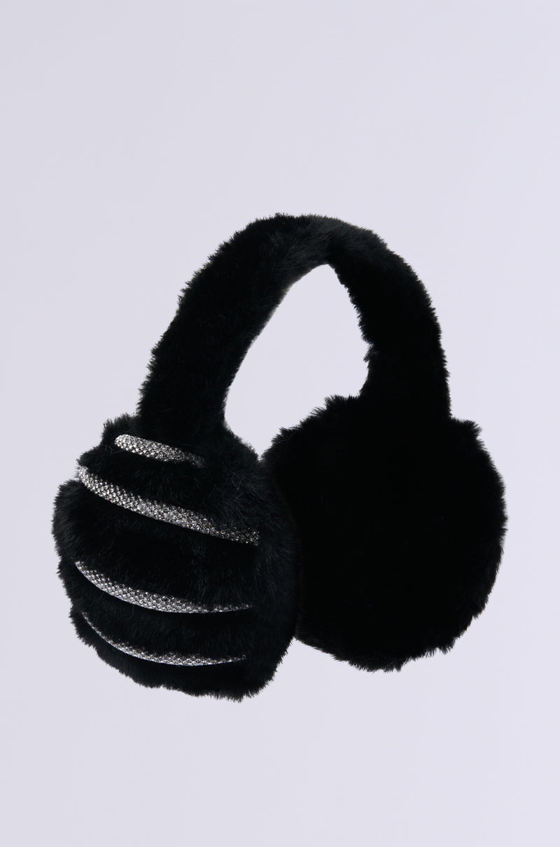 The chic NOT SO TYPICAL FAUX FUR EAR MUFFS boast a black faux fur design with a plush texture and one-sided metallic stripes. This winter accessory elegantly complements any outfit against the plain white backdrop.