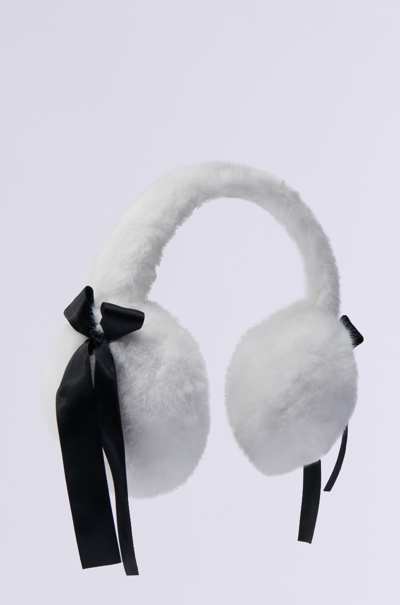 The GIRLY POP FAUX FUR EAR MUFFS feature plush faux fur and black satin ribbon accents on each side, making them an essential cold weather accessory against a light background.