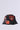 The WITH LOVE PATCH BUCKET HAT is a black bucket hat featuring vibrant embroidered patches, such as heart-shaped designs and a mask-like motif. This embellished accessory is accented with intricate beadwork and decorative details for a bold, artistic look.