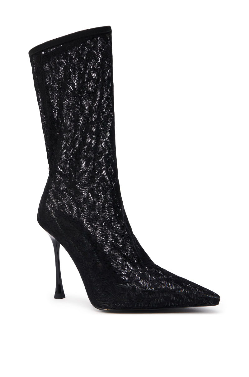 The AZALEA WANG NICKLAS BLACK LEOPARD STILETTO BOOTIE showcases a pointed toe, high heel, and sheer mesh upper, delivering alluring texture and style throughout the boot.