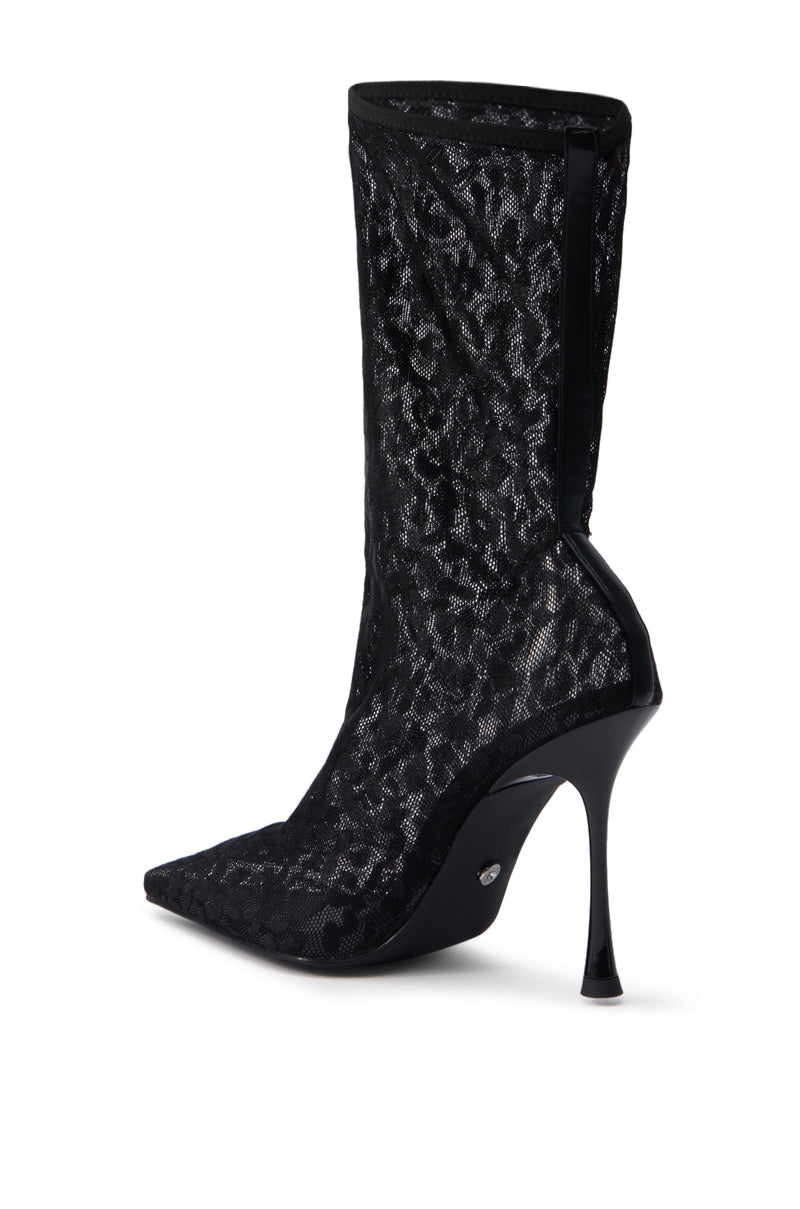 The AZALEA WANG NICKLAS BLACK LEOPARD STILETTO BOOTIE features a pointed toe, sheer mesh upper, stiletto heel, and glossy black finish with chic leopard styling.