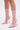 A pair of legs wearing the AZALEA WANG NICKLAS PINK LEOPARD STILETO BOOTIE, featuring a pointed toe and sheer mesh upper with a light pink leopard print on a white background.