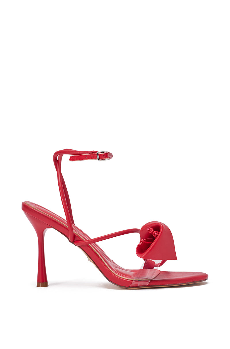 The AZALEA WANG NILOU MONOCHROME RED FLORAL DECALE STRAP STILETTO SANDAL features red faux leather, an ankle strap, a thin toe strap with a floral decal, and a flared stiletto heel for added elegance. 4