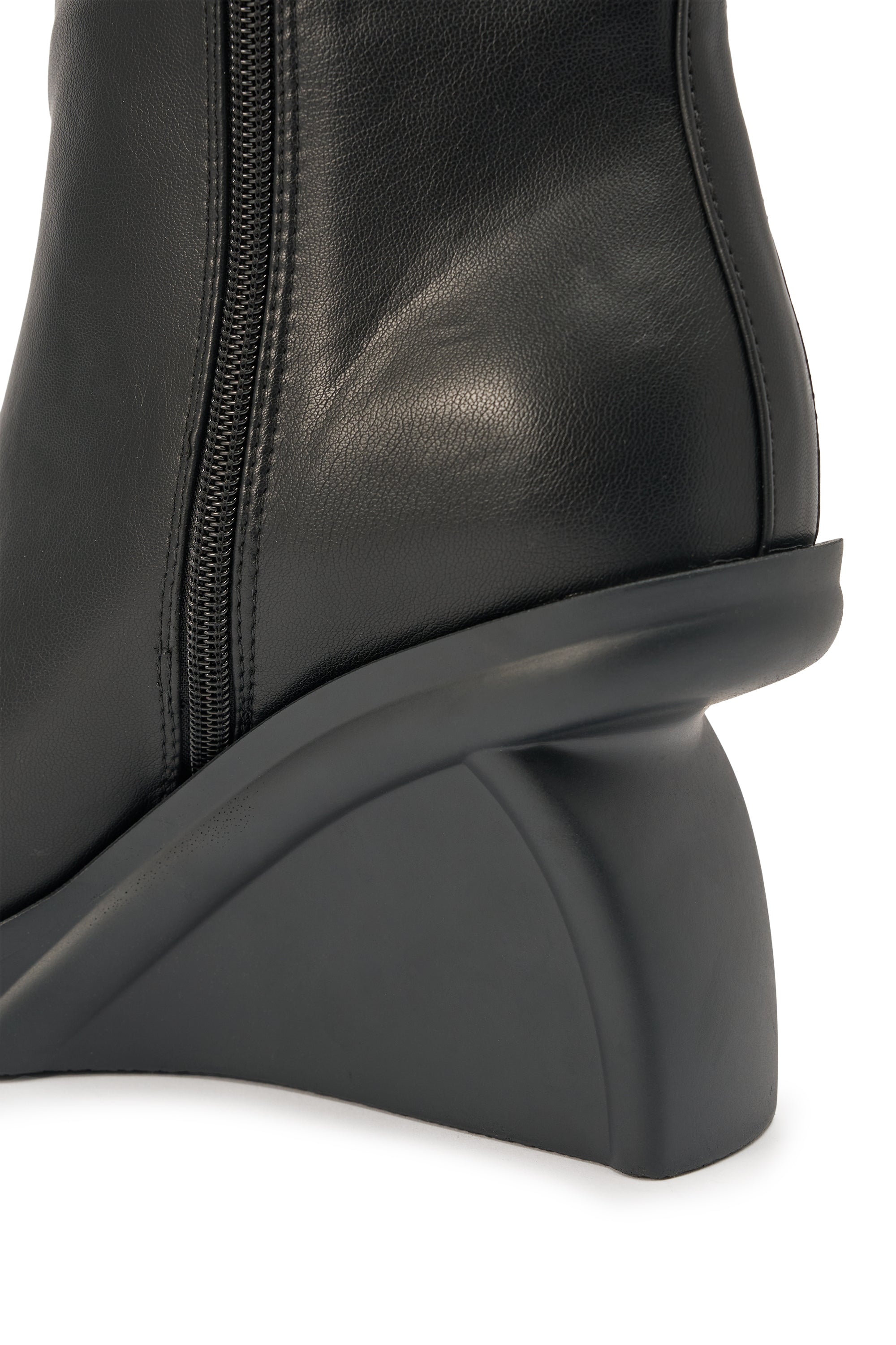 Close-up of the AZALEA WANG NOLIA BLACK NOVELTY WEDGE BOOTIE—a sleek black leather mid-calf bootie with side zipper and distinctive matte black sculpted wedge heel. 6
