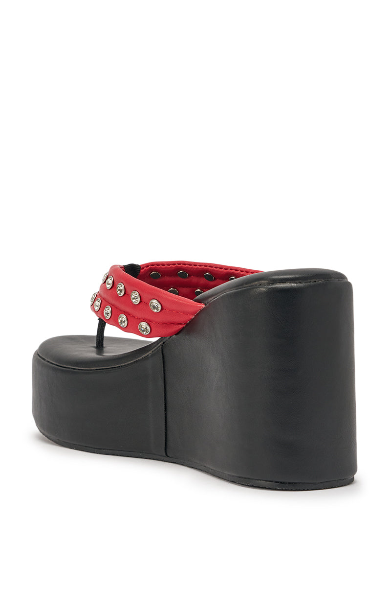 The AZALEA WANG NOVELLE Black and Red Stud Embellished Platform Sandal features a thick black wedge sole and red studded thong strap, seen from the back for a bold, standout look. 5