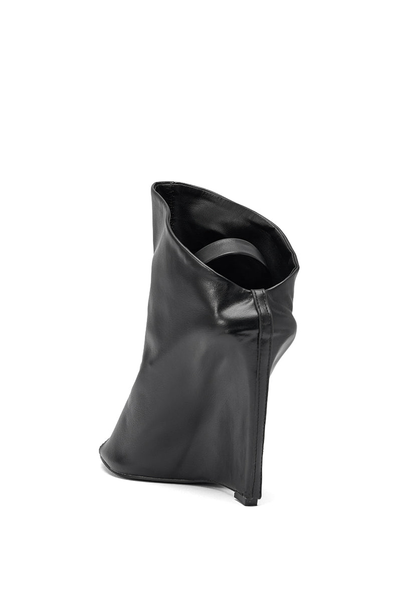 The AZALEA WANG NOVIS BLACK PU WEDGE BOOTIE is a sculptural black faux leather bootie with a high wedge heel and a soft, slouchy shaft for a modern look, displayed against a plain white background. 6