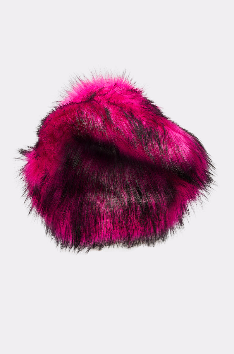 The HOTTIE FAUX FUR BUCKET HAT is a vibrant faux fur bucket hat in bright pink with black streaks, shown against a plain white background. 3