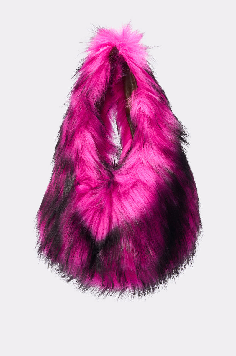 The IN NYC FAUX FUR PURSE is a bright pink faux fur handbag with black accents, a triangular shape, and a single handle, shown against a plain white background.