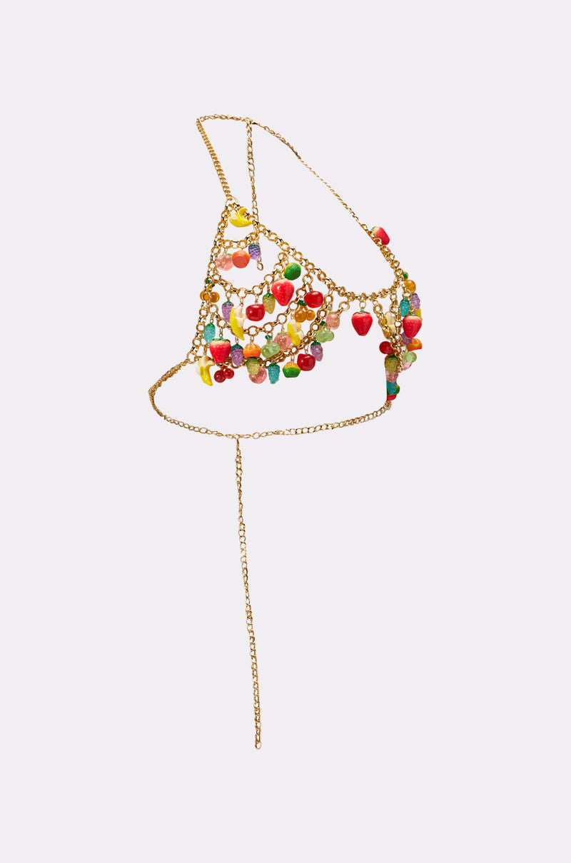 The TASTE ME FRUITY BODY CHAIN features a gold body chain bralette with colorful beads, fruit charms, and hearts in an asymmetrical design—an eye-catching festival accessory. 8