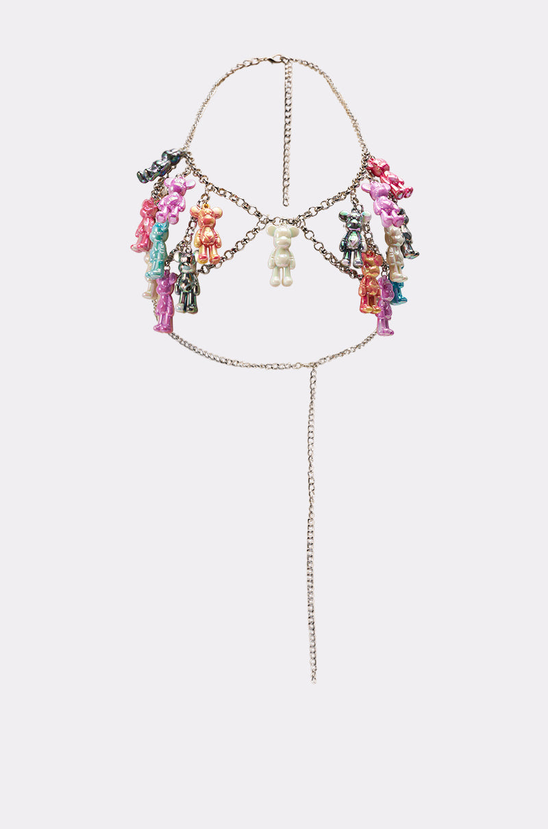Make a statement with the BEARY CUTE BODY CHAIN, a silver Y2K-inspired layered harness necklace featuring playful teddy bear charms in pink, purple, blue, black, and white dangling from different points. 9