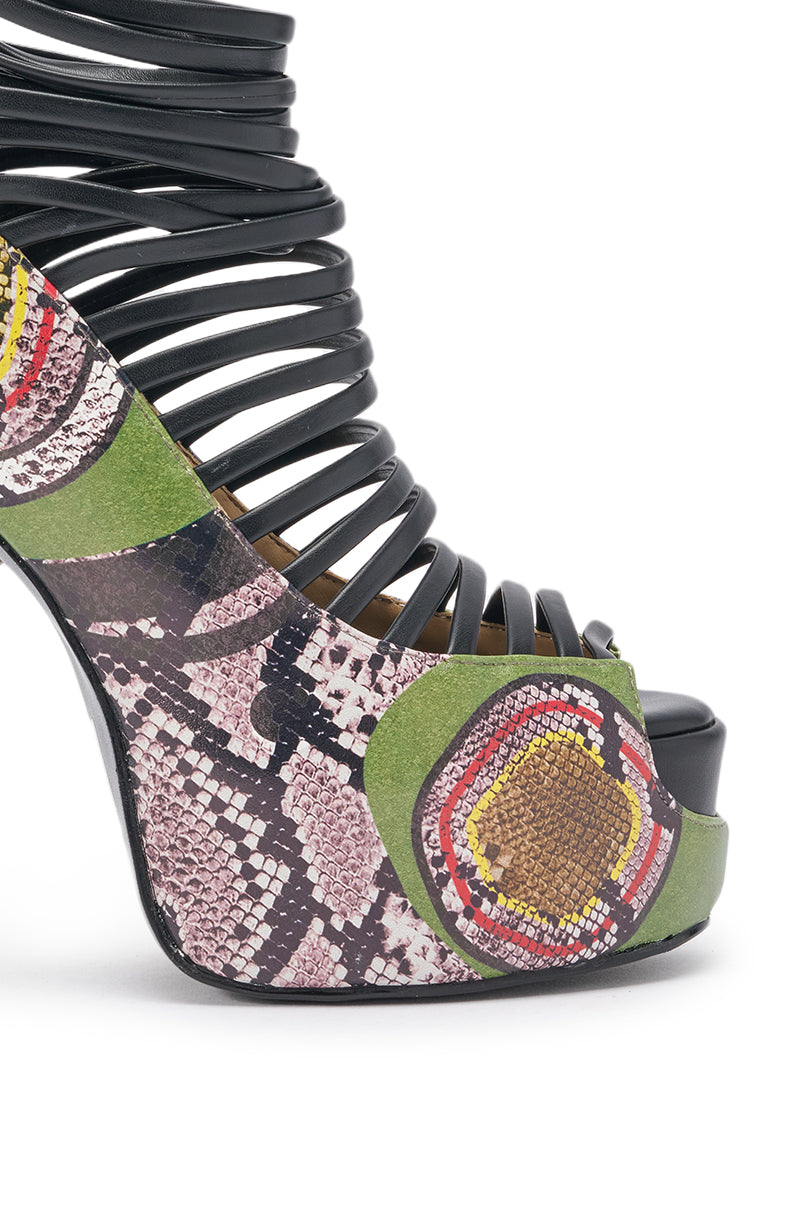 The AKIRA GOLD OBSESSED SNAKE PRINT PU PLATFORM STILETTO SANDAL features black strappy bands, a platform sole, and stiletto heels with a bold, multicolor snake print design in green, pink, yellow, and brown for a striking look. 6