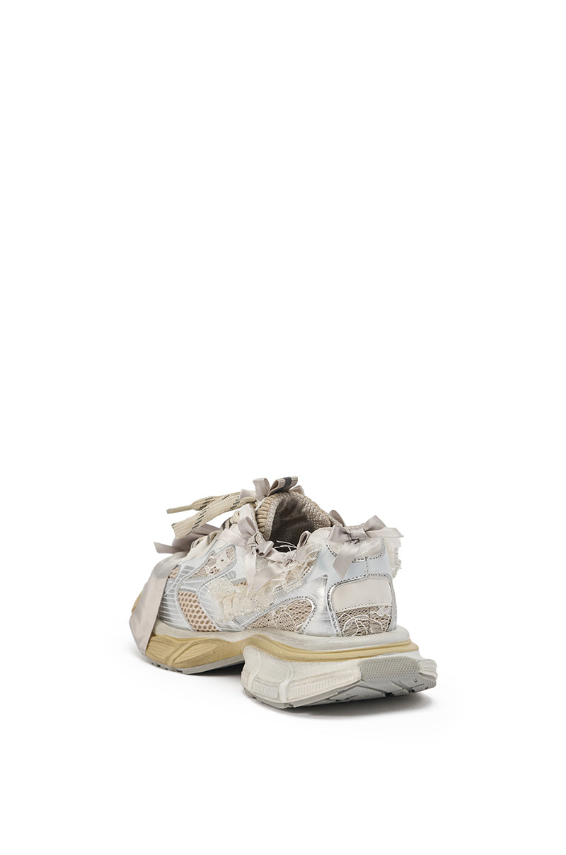 The AZALEA WANG OCTAVIA White Bow Embellished Chunky Sneakers feature a distressed, off-white look with frayed edges and visible wear, shown from the back against a plain white background. 6
