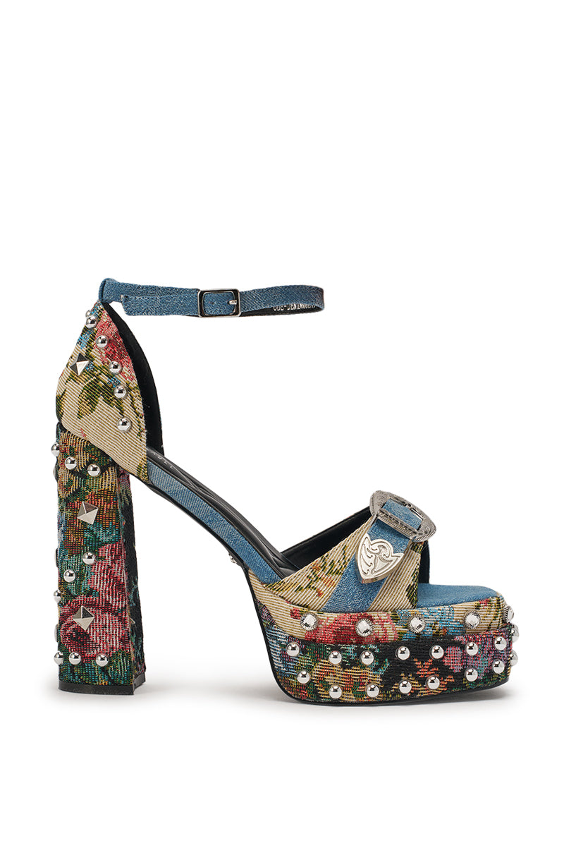 The AKIRA GOLD ODE DENIM MULTI CHUNKY RHINESTONE SANDAL features a block heel, thick ankle strap with buckle, vibrant denim and floral tapestry design, plus rhinestone embellishments. A perfect pick for fans of bold denim brocade sandals!. 3