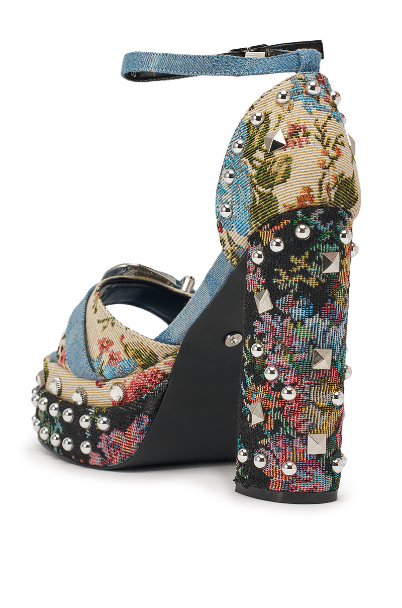 The AKIRA GOLD ODE DENIM MULTI CHUNKY RHINESTONE SANDAL features floral tapestry fabric, metallic studs, faux pearls, denim accents, and a chunky block heel—perfect statement sandals for festivals. 5