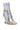 The AZALEA WANG ODETA GOLD SANDAL is a high-fashion stiletto boot with a futuristic design, crafted from faux metallic leather. This metallic silver boot features a narrow, tightly wrinkled appearance and is accented by thin gold straps and a uniquely shaped gold heel that resembles the bottom of a small trumpet or horn.