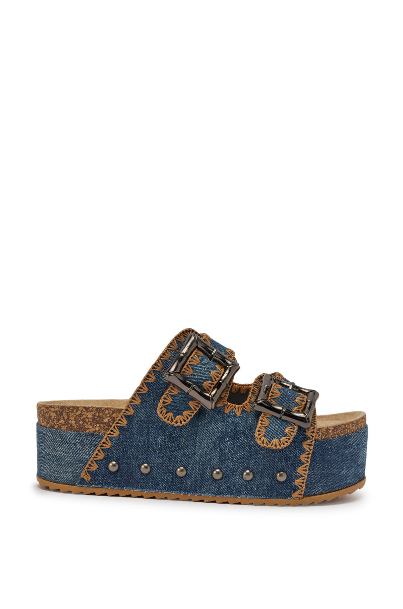 Step into summer style with the AZALEA WANG OHKAY DENIM FLAT PLATFORM SANDAL, featuring blue denim, twin buckle straps, tan stitching, silver studs on the sole, and a comfy cork footbed—your perfect go-to sandal. 3