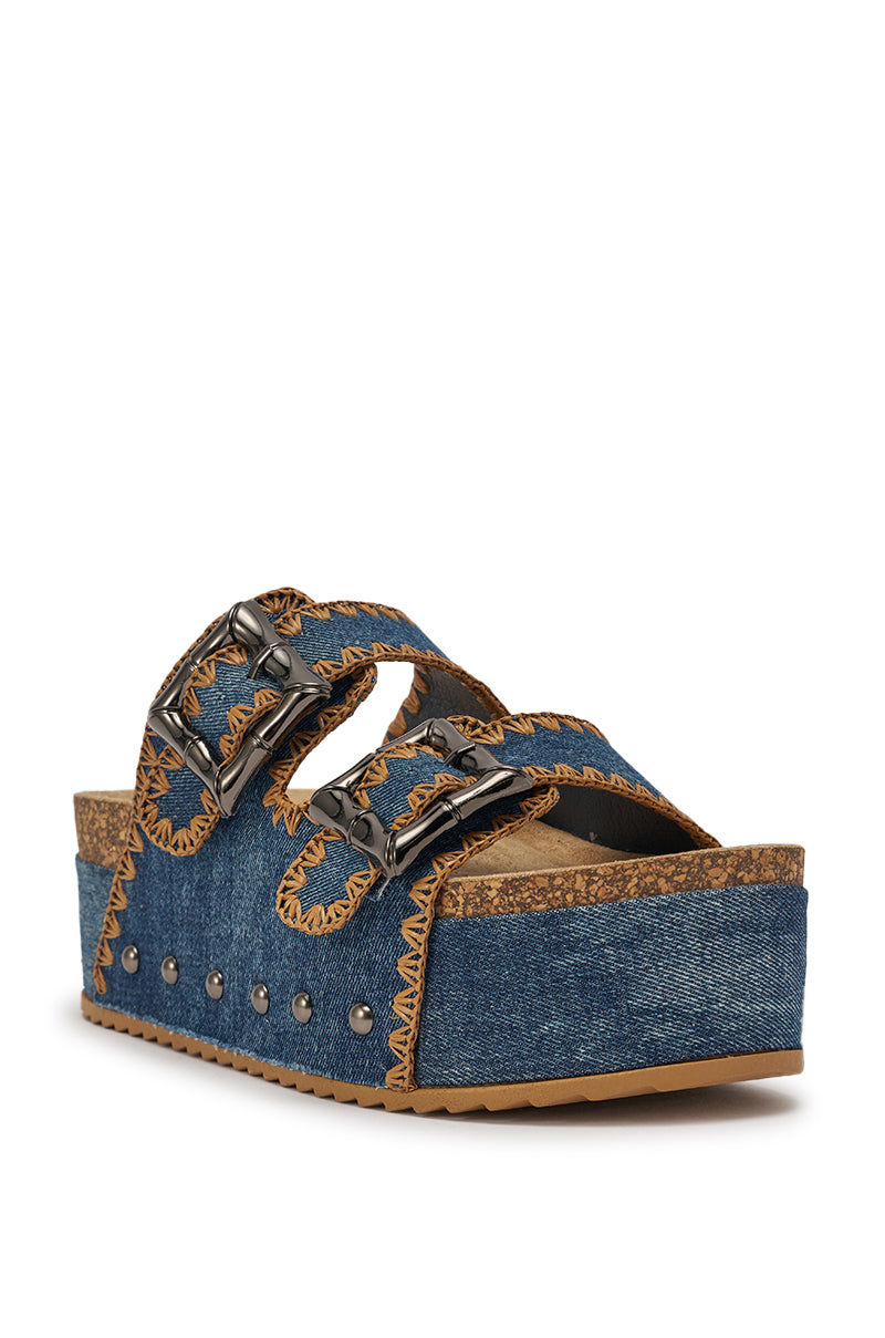 The AZALEA WANG OHKAY DENIM FLAT PLATFORM SANDAL features tan stitching, two oversized buckle straps, metallic side studs, and a cork-textured sole—perfect for taking your summer sandal style up a notch. 4