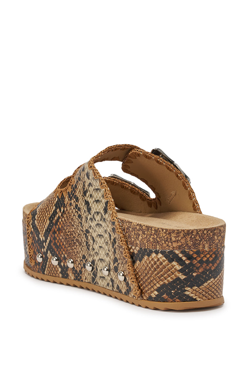 The AZALEA WANG OHKAY SNAKE FLATFORM STUD EMBELLISHED SLIP ON SANDAL features brown and tan faux snakeskin, silver studs on the sole, thick straps, an open toe, and a chunky platform heel for stylish comfort. 5