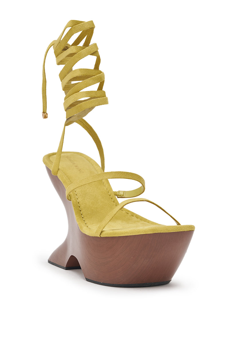 The AZALEA WANG ONNI CITRON WEDGE SANDAL features a yellow strappy design, a tall sculptural wedge heel, and long lace-up ankle ties that wrap elegantly around the ankle. 5