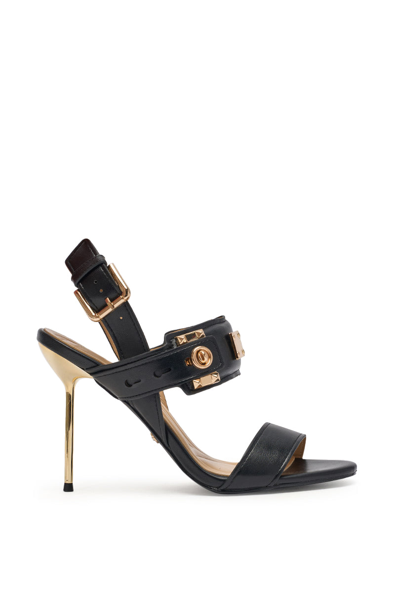 The AZALEA WANG OREL BLACK HARDWARE EMBELLISHED STILETTO SANDAL features black faux leather, gold accents, a gold heel, two buckle straps, and bold gold hardware—sleek open-toe heels perfect for a modern night out. 3