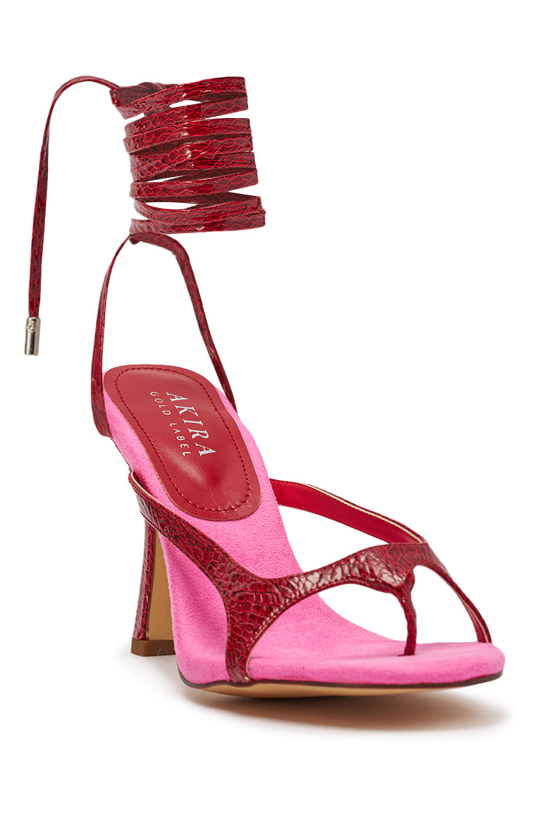 The AZALEA WANG OTRISSE RED AND PINK PU AND FAUX SUEDE STRAPPY STILETTO SANDAL features red and pink crocodile-embossed straps, wrap-around ankle tie, open toe, pink sole, and a medium stiletto heel. 4