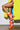 Someone is wearing the AZALEA WANG PAMINA ORANGE CHUNKY SANDAL, bright orange lace-up heels with white stripes and a platform sole, paired with a bold yellow fur coat and a colorful patterned dress against a plain background.