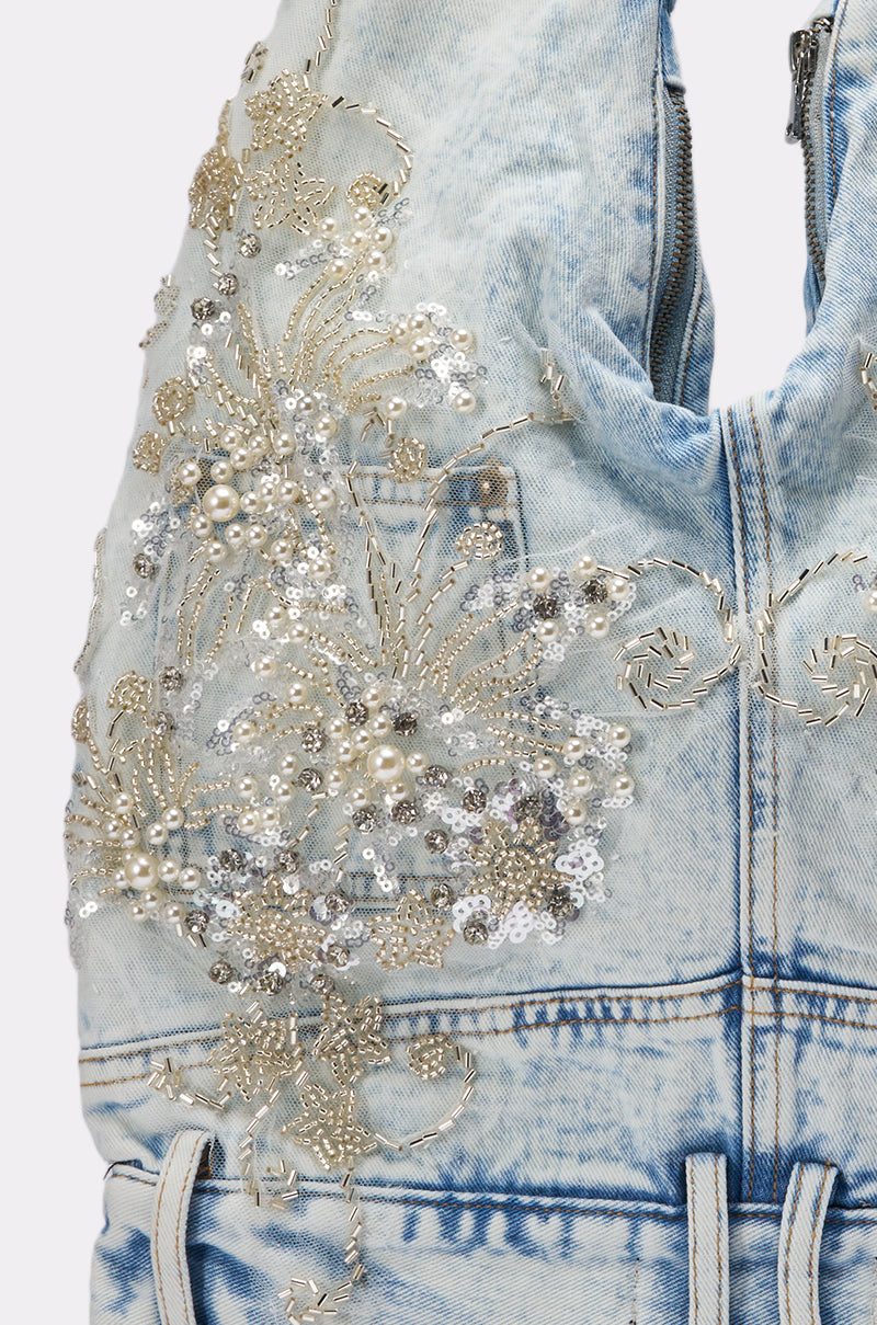 Close-up of the BLESSING IN DENIM EMBELLISHED SHOULDER BAG, showcasing silver and white beaded and sequined floral embroidery with pearl accents and detailed stitching. 3