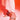 Someone wears white pants and the AZALEA WANG PAOLINA GOLD SANDAL, featuring clear high heels with large sparkling rhinestones, while standing on a surface lit in pink and orange.