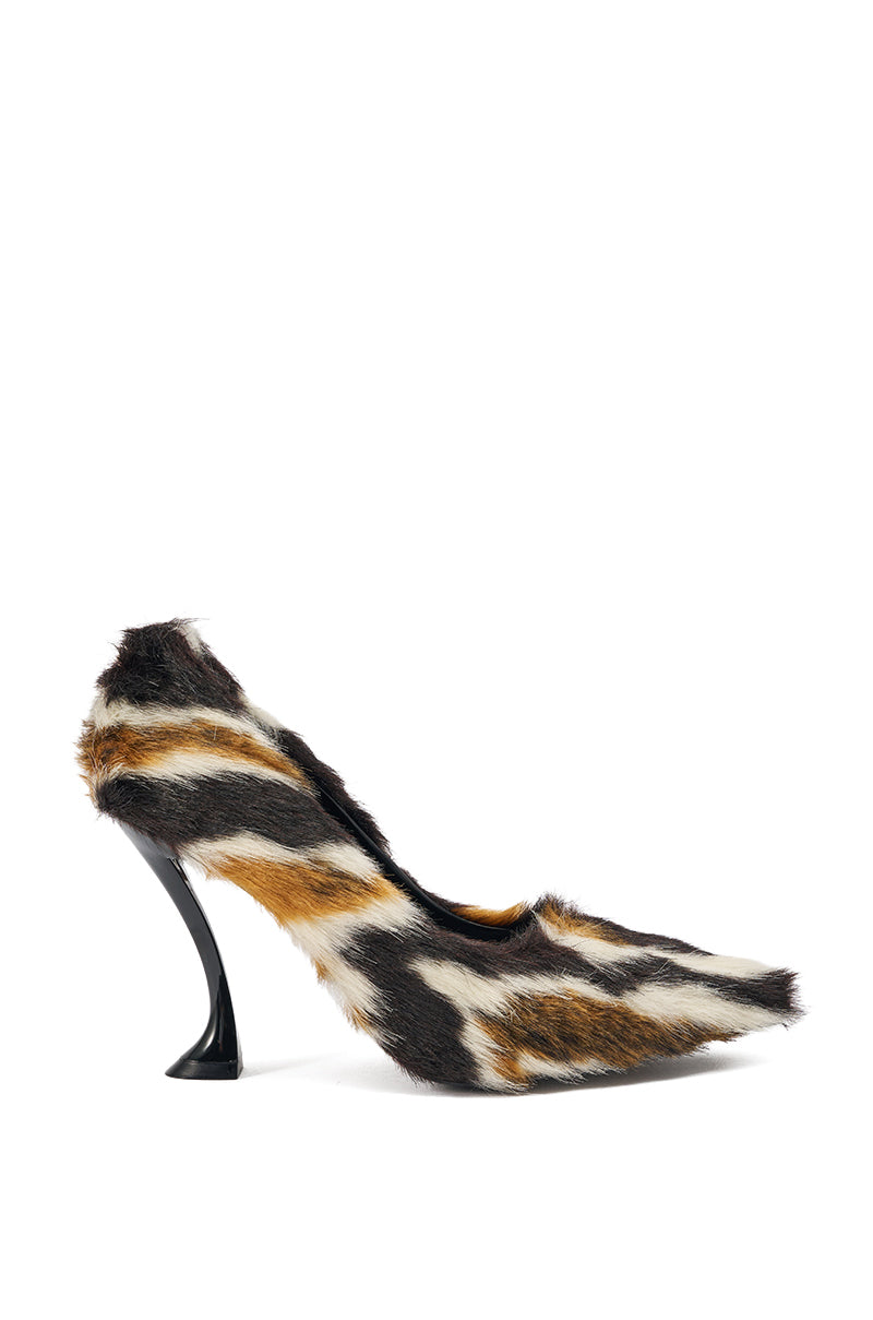 The AZALEA WANG PAULHINO FAUX FUR PUMP features a pointed toe, curved black stiletto heel, and a zebra-inspired pattern in black, white, and brown stripes. 2