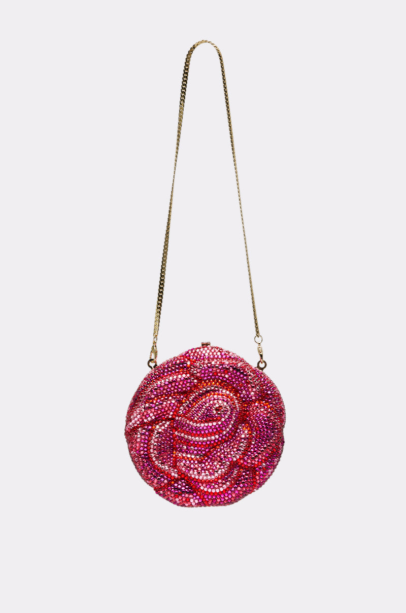 The NOT THAT KIND OF ROSE PURSE is a round handbag with a gold chain strap, featuring pink and red rhinestones in a rose pattern—an eye-catching novelty accessory displayed on a plain white background. 3