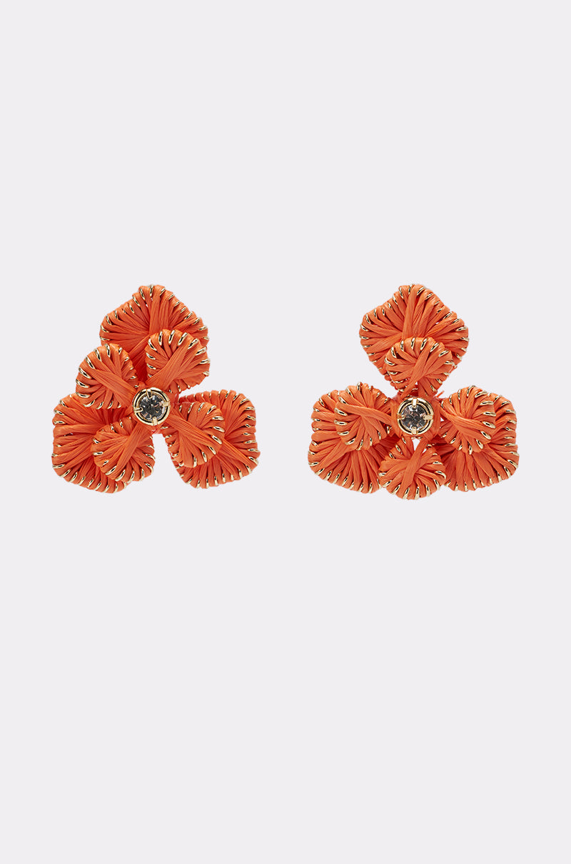 ON THE BEACH EARRINGS: Vibrant orange floral statement earrings featuring woven petal details and a central round gem, shown on a white background. 1