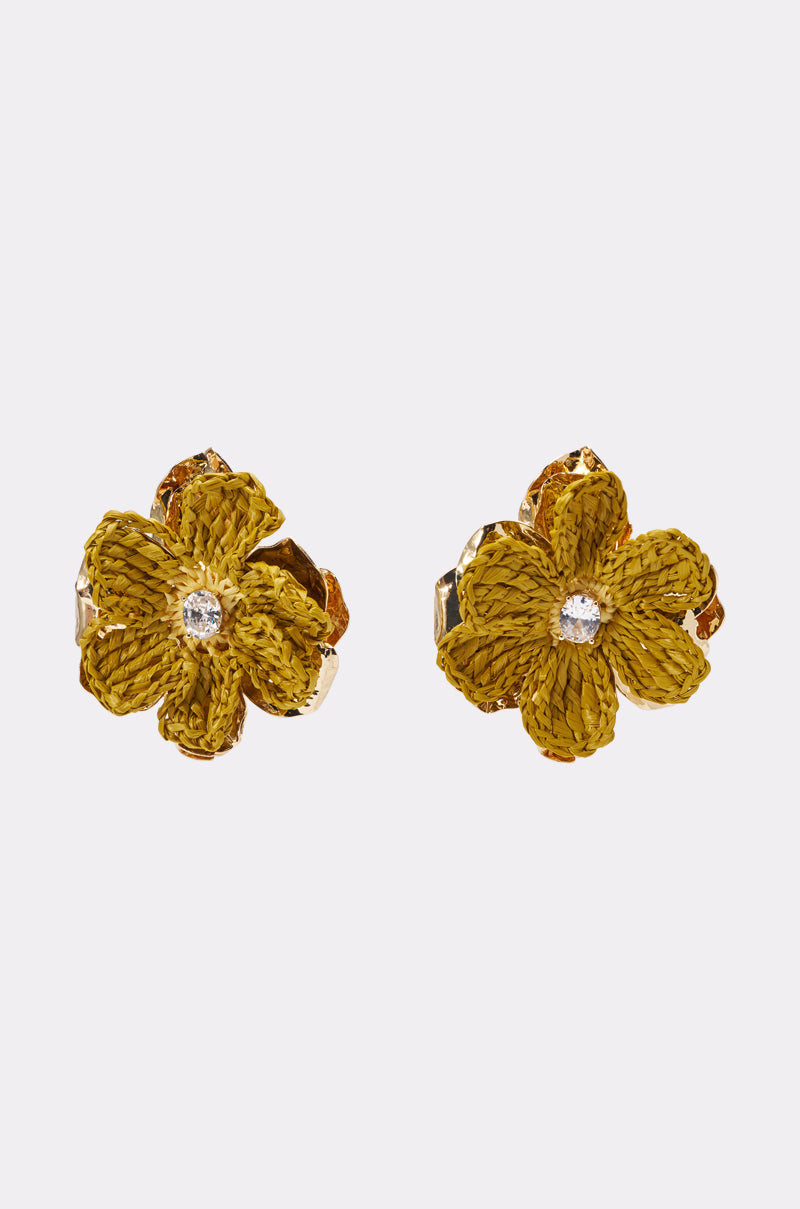 The GOLDEN HOUR EARRING features yellow floral statement petals with a textured design and a sparkling rhinestone center, showcased against a plain light background. 1
