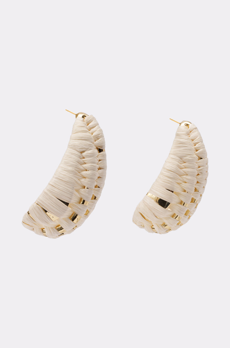 The TO TULUM EARRING features crescent shapes made from woven light-toned material with gold accents, ideal for luxe styling or vacation wear, shown against a simple light background.
