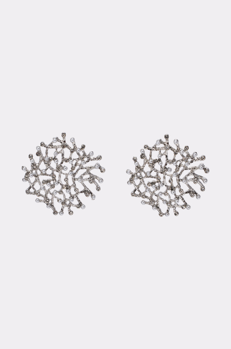 The TO THE REEF EARRING features silver, round statement earrings with intricate coral branch designs, adorned with clear gemstones, displayed on a plain white background. 0