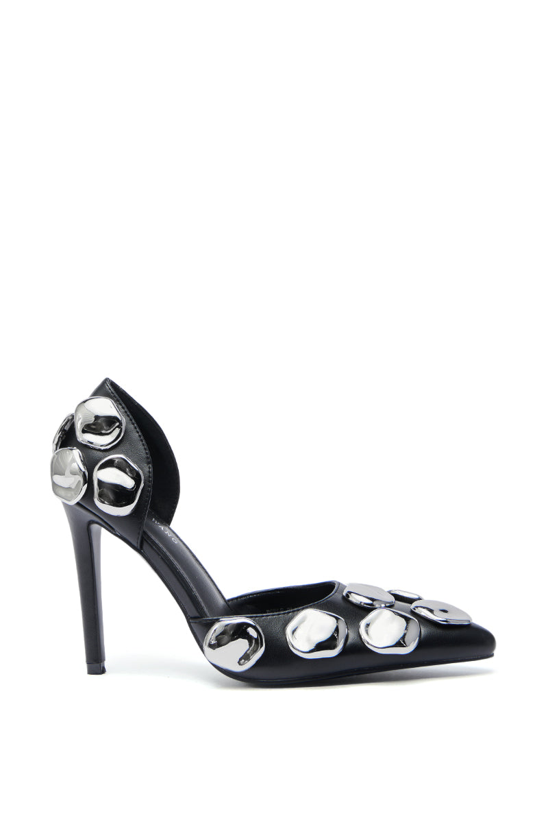 The AZALEA WANG PERLE Black Pump features a pointed toe and stiletto heel, with large shiny silver metal embellishments on the toe, side, and heel, displayed against a white background.