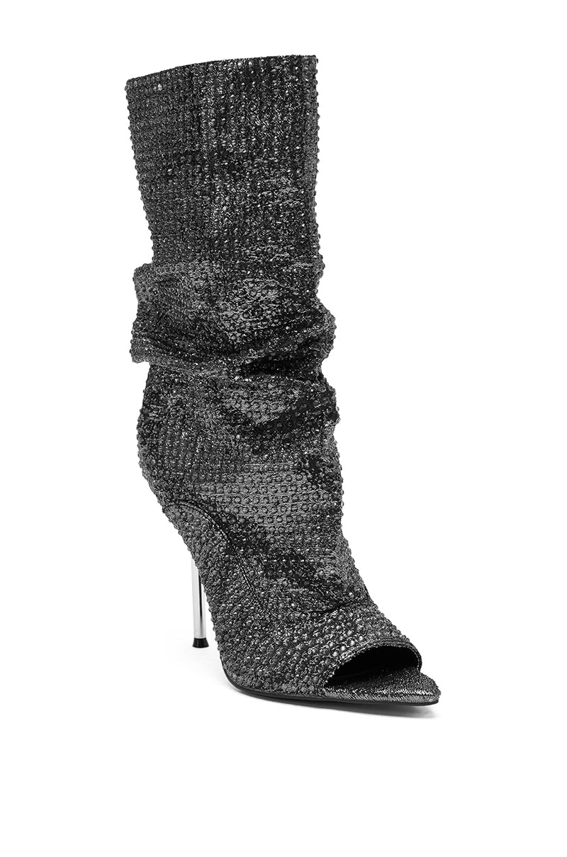 The AZALEA WANG PHOTINE Black Multi Sparkle Open Toe Stiletto Bootie features a high heel, slouchy silhouette, black rhinestone embellishments, an open peep toe, and a slim stiletto heel.
