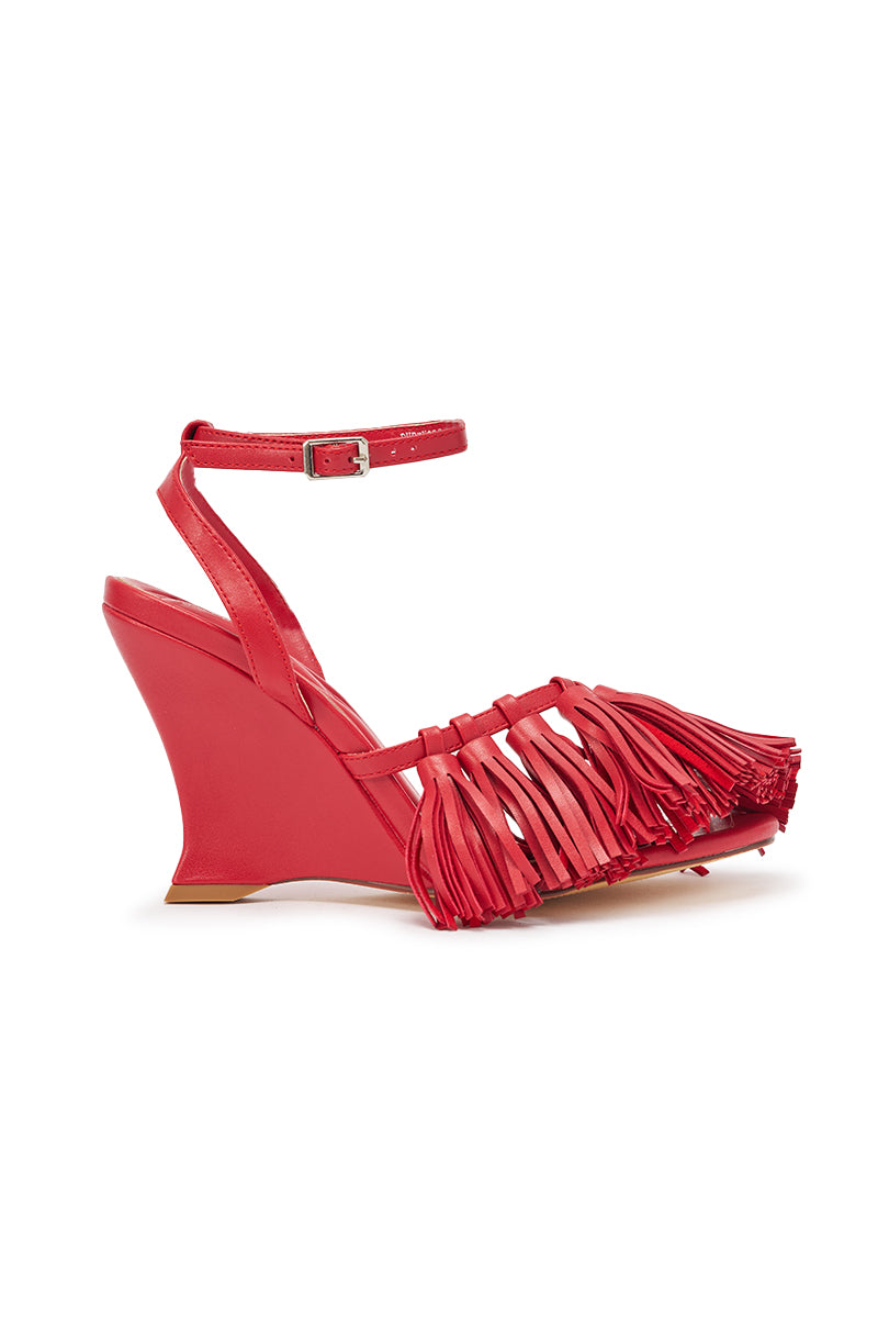 The AZALEA WANG PHRIXOS Red Wedge Fringe PU Sandal features a high wedge heel, ankle strap, pointed open toe, and decorative fringe for a bold, stylish statement that's comfortable to wear. 3