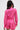 A person with long dark hair wears the LOOK THIS WAY SHINY BODYSUIT by AKIRA Label in hot pink, featuring a metallic finish for a bold, eye-catching look.