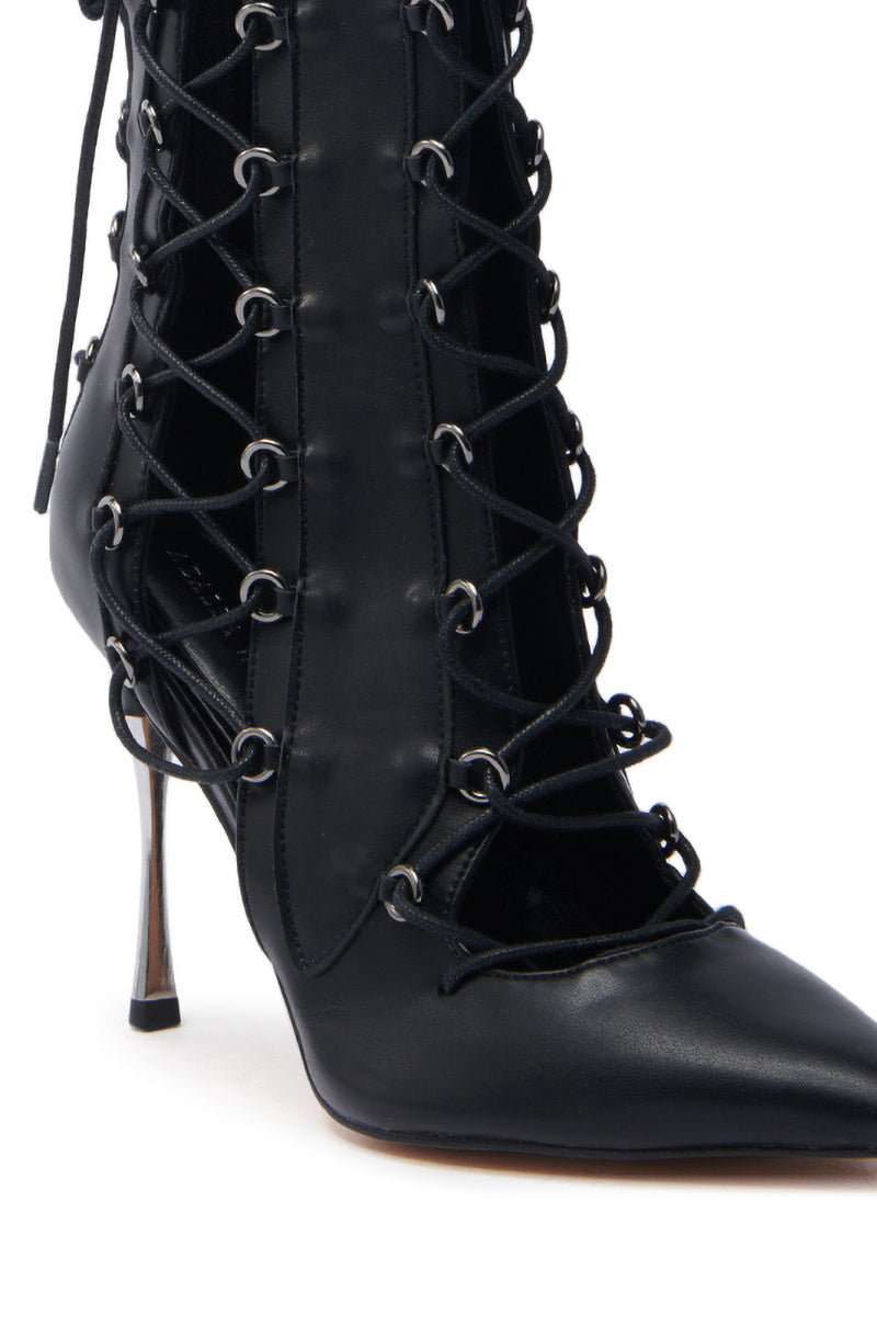 The AZALEA WANG PONCIA BLACK LACE UP BOOTIE showcases a black faux leather design with intricate detailing, metal eyelets, and a slender stiletto heel for a sleek and edgy look.