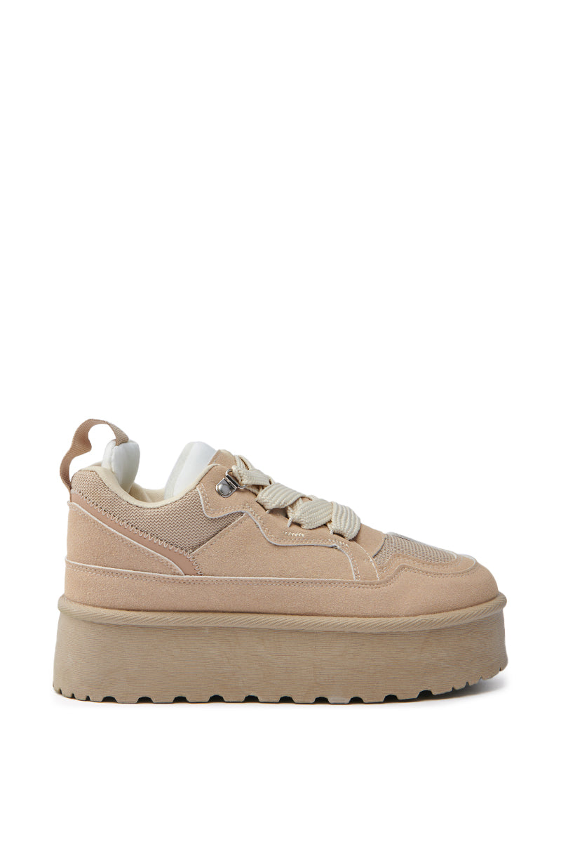 The POPULARITY SAND FLATFORM SNEAKER features a tan suede upper, almond toe, chunky beige sole, cream laces, detailed stitching, and a heel pull tab. The lining is white. 3