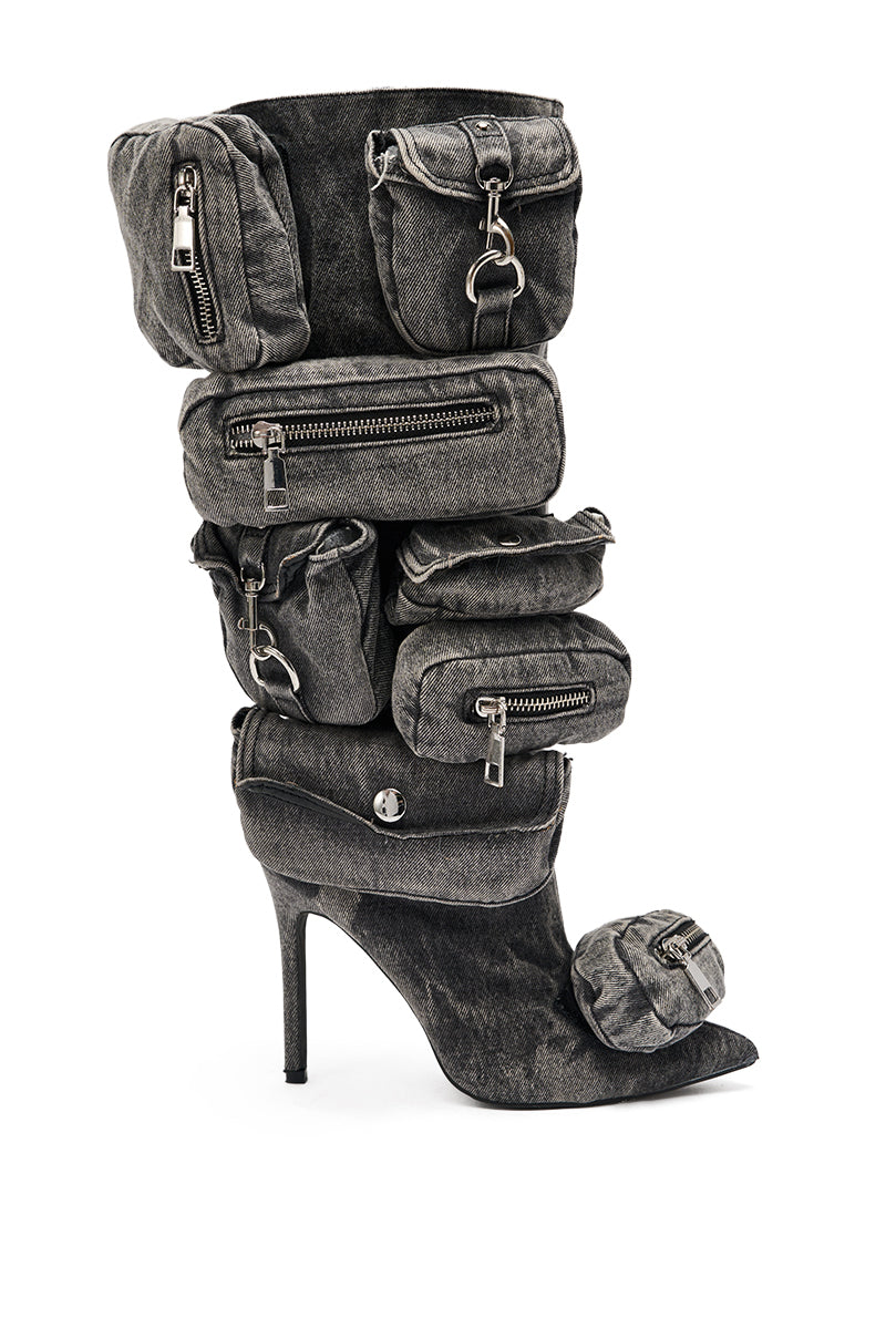The AZALEA WANG PRAVIN BLACK POCKET DETAIL STILETTO BOOT is a knee-high denim stiletto featuring standout zippered and buttoned pouch pockets along the shaft and toe. 3