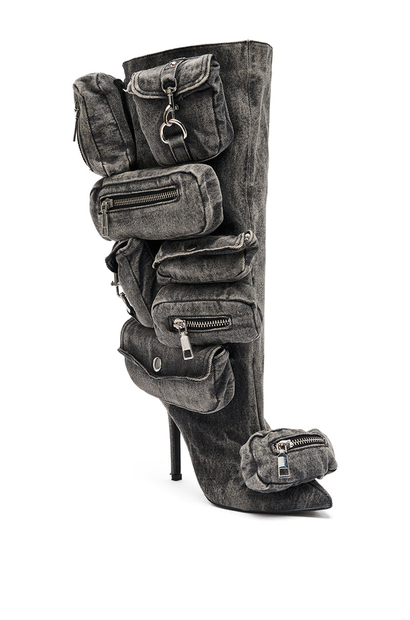 The AZALEA WANG PRAVIN BLACK POCKET DETAIL STILETTO BOOT is a knee-high, high-heeled boot featuring a sleek black look with multiple zippered pouches and pockets in various sizes. 4