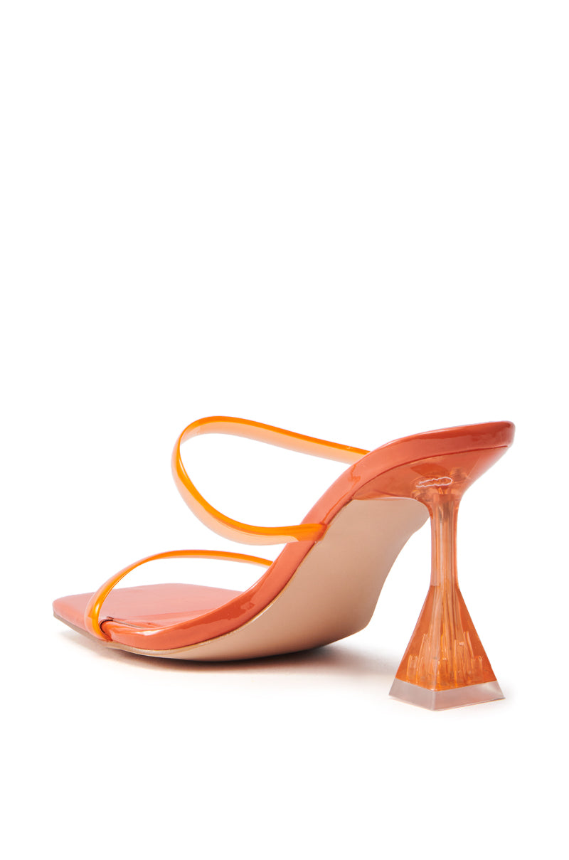 The AZALEA WANG PTAH Orange Jelly Chunky Slip On Sandal features an open toe design, glossy finish, thin straps, and a clear pyramid heel, shown from the rear on a white background.