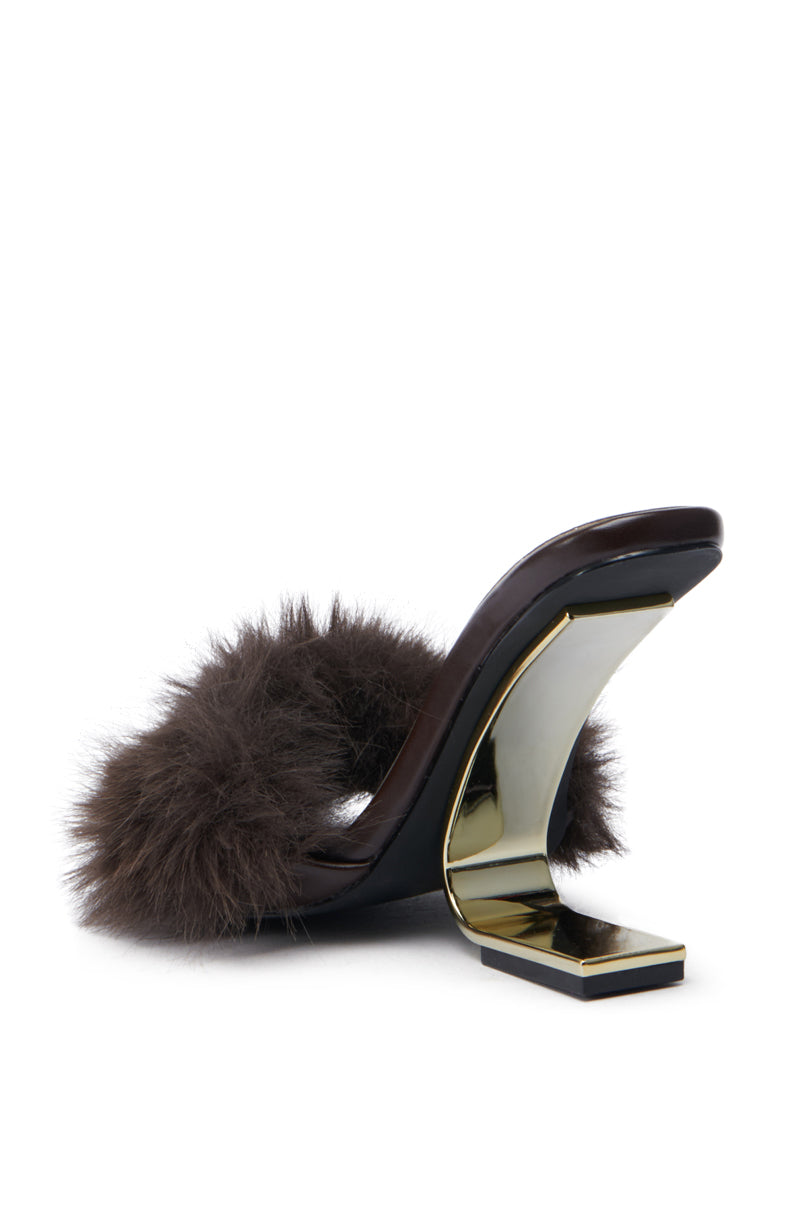 The AZALEA WANG PUPON Brown Fur Sandal with Wedge Heel, featuring a fluffy strap and distinctive gold angular heel design, along with a comfort cushion insole, is elegantly showcased against a white background.