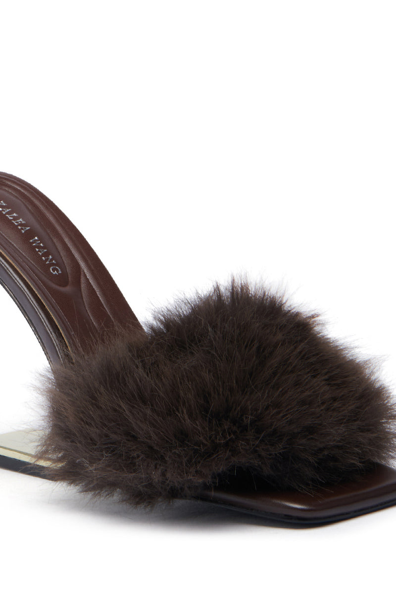 Close-up of the AZALEA WANG PUPON Brown Fur Sandal with Wedge Heel, featuring a single heeled design. This sandal showcases a dark brown fur-like strap and a glossy faux leather footbed. The angled fur wedge heel to the left highlights the plush texture of the strap.