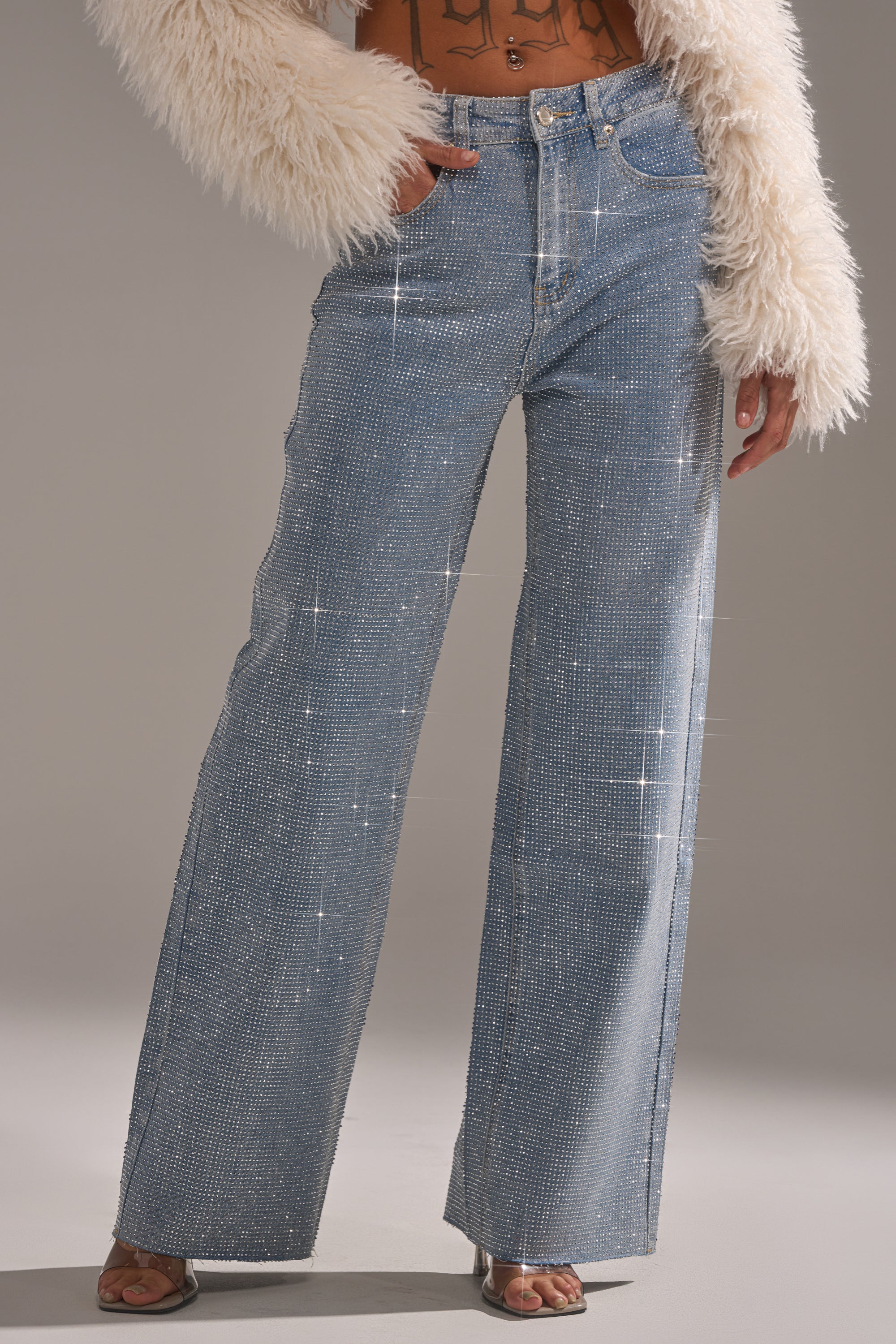 A person wearing the DANCING QUEEN RELAXED DENIM jeans.